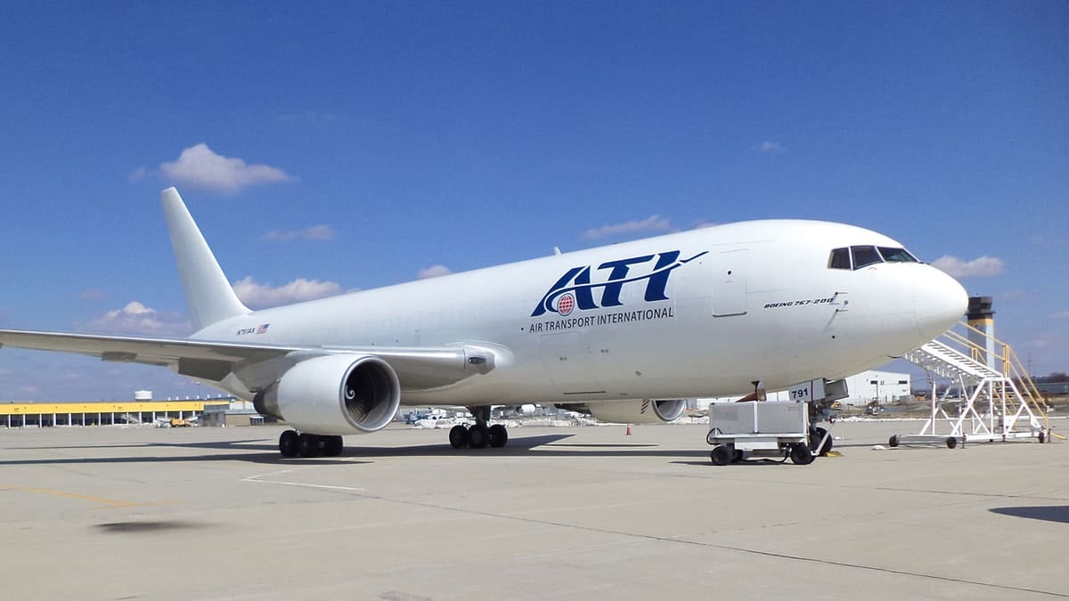 A white jet parked on sunny day. Air Transport International released its earnings Wednesday.