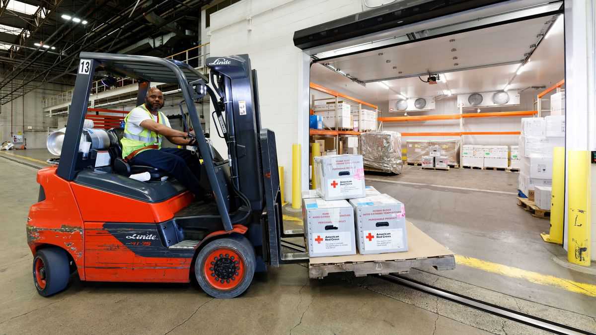 A forklift operator moves packages of blood at Lufthansa's cold storage facility in Chicago.