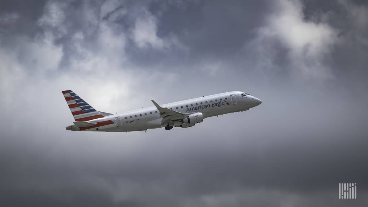 An American Eagle jet on ascent through the clouds. Mesa Airlines operates the jets and will soon fly cargo jets for DHL.