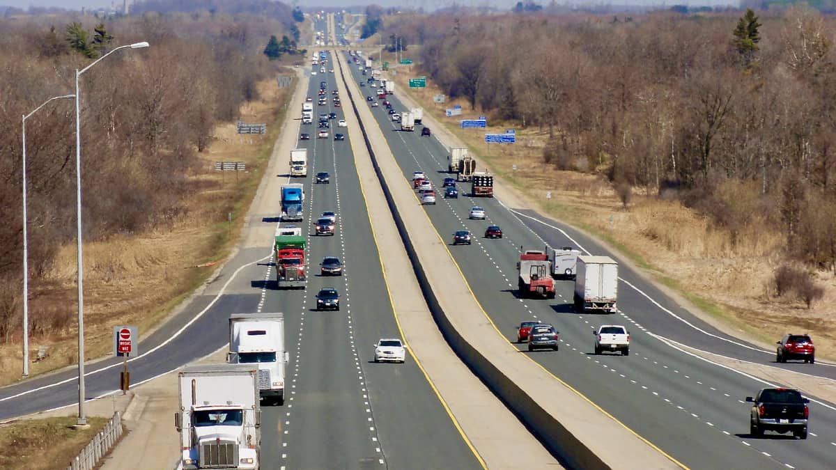 Trucks drive on Highway 401, where police say they found a truck driver smoking opium