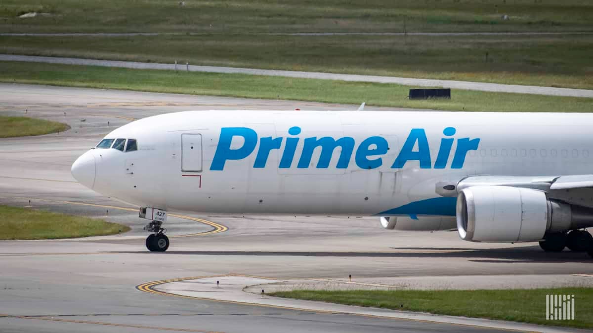 Front-half of a white Amazon jet with the words "Amazon Prime" on the side. Amazon is giving more flying business to ATSG, an air cargo carrier.