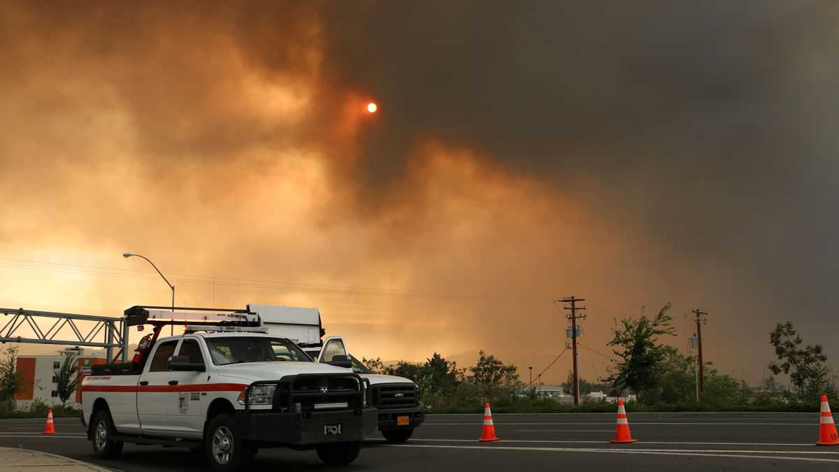 Wildfires in Oregon; Oregon DOT service vehicle in foreground.