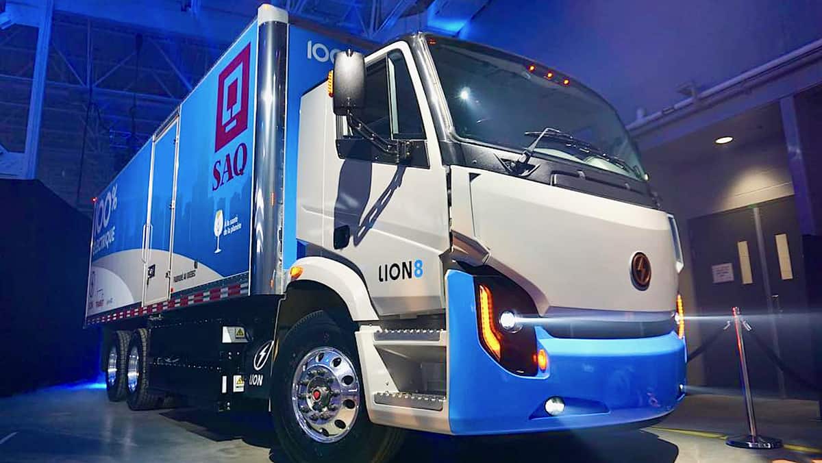 A Lion8 electric truck with a trailer produced by the Lion Electric Co.