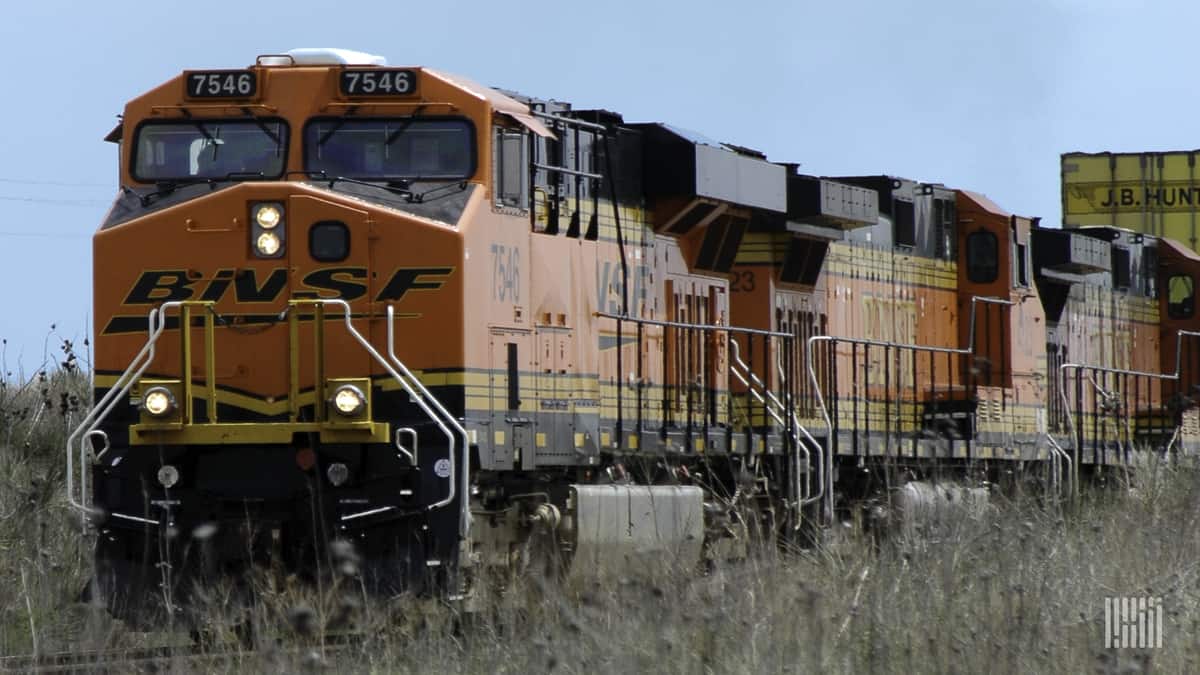 A photograph of a BNSF train traveling through a field.