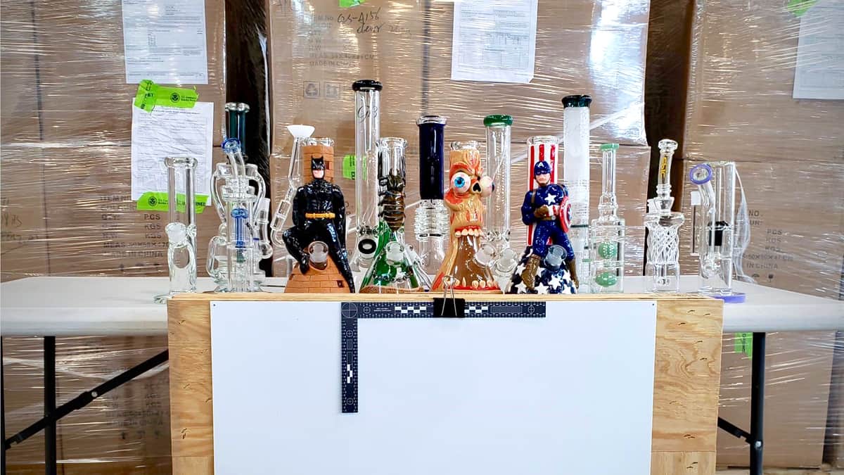 Glass bongs are lined up after being seized by from a truck at the US Canada border, amid a rise of marijuana seizures.