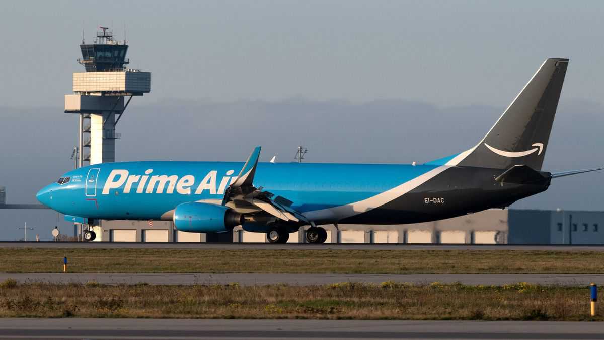 Light blue 737 cargo jet in Amazon Air branding.