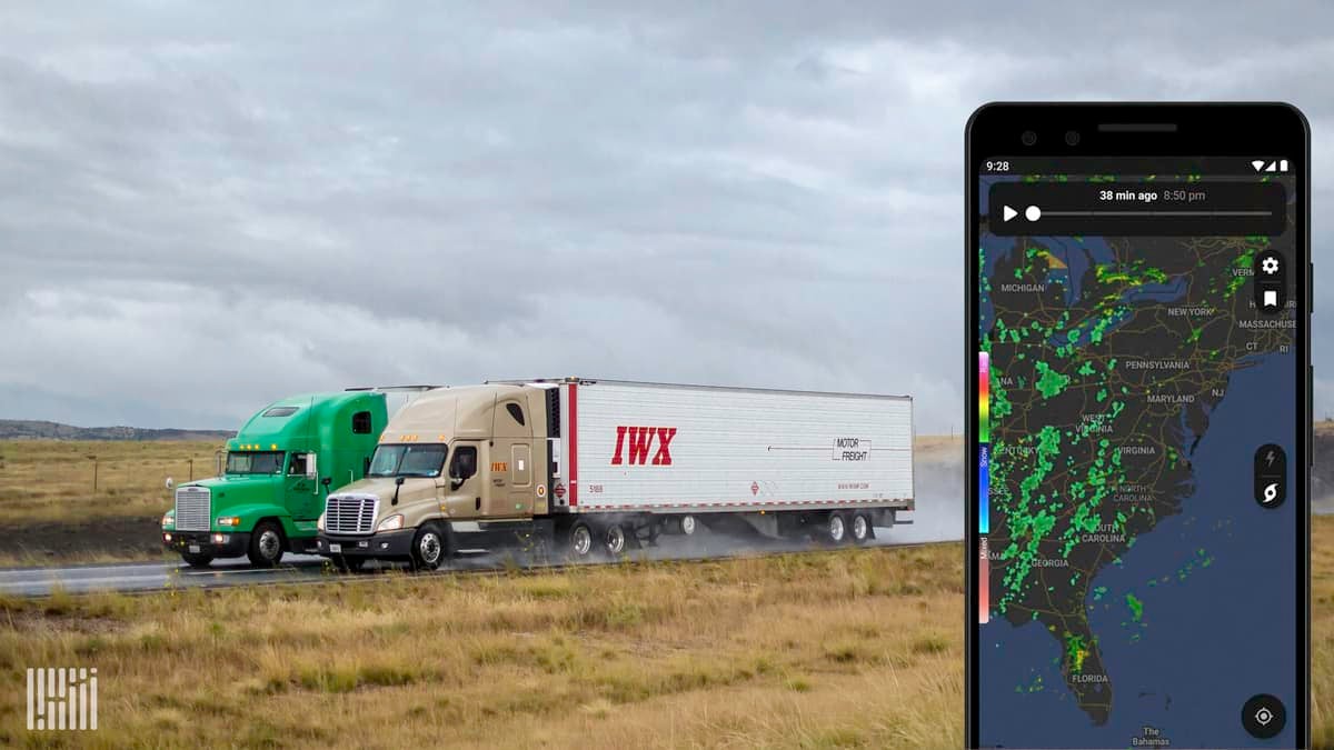 Tractor-trailers heading down a highway. Inlay photo of a mobile phone showing the NOAA radar app.