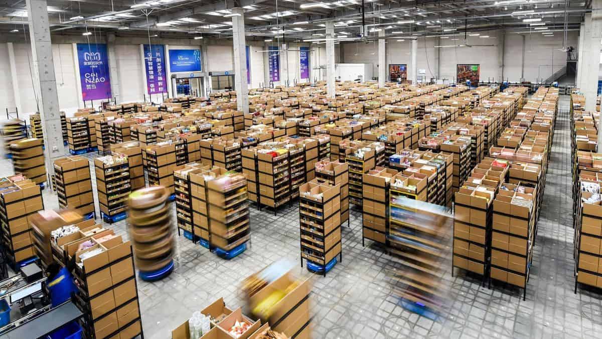 Stacks of boxes on robot sleds in warehouse.