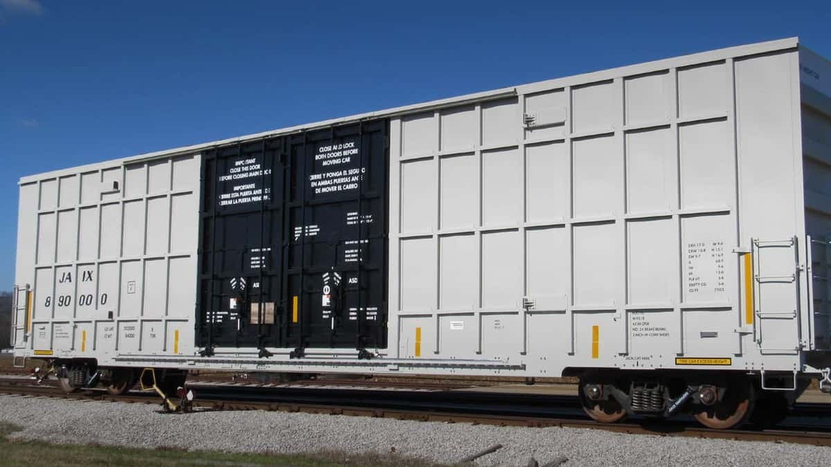 A photograph of a railcar in a yard.