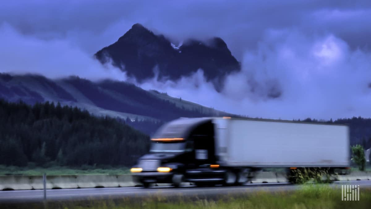 truck drives down highway