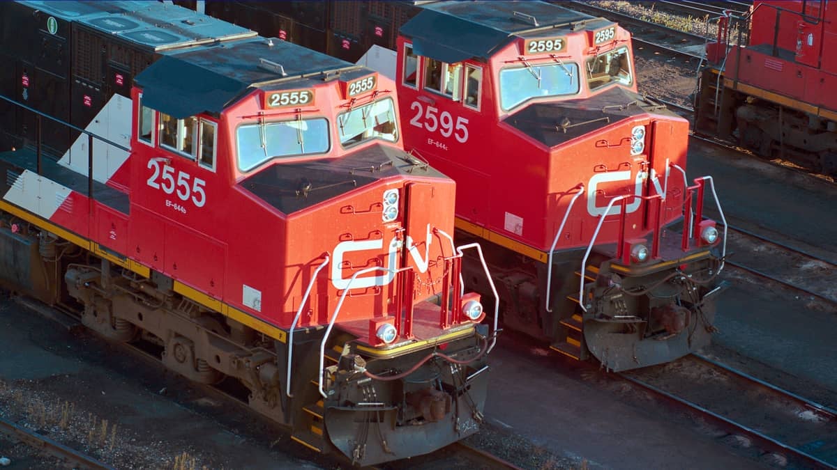 A photograph of two CN locomotives parked in a rail yard.