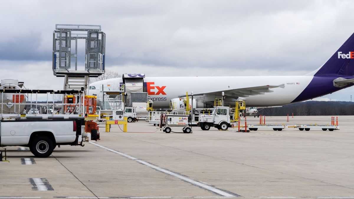 White FedEx cargo aircraft loaded with coronavirus vaccine in Michigan.