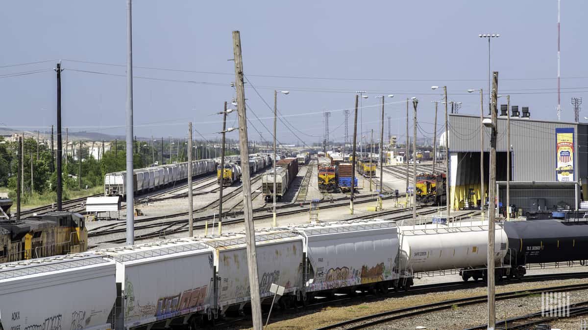 A photograph of a railcars in a rail yard.