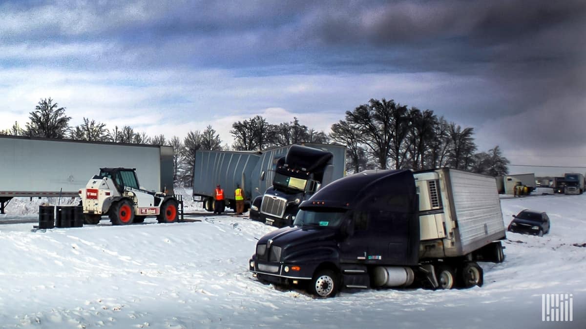 Damaged tractor-trailers skidded off a snowy highway.