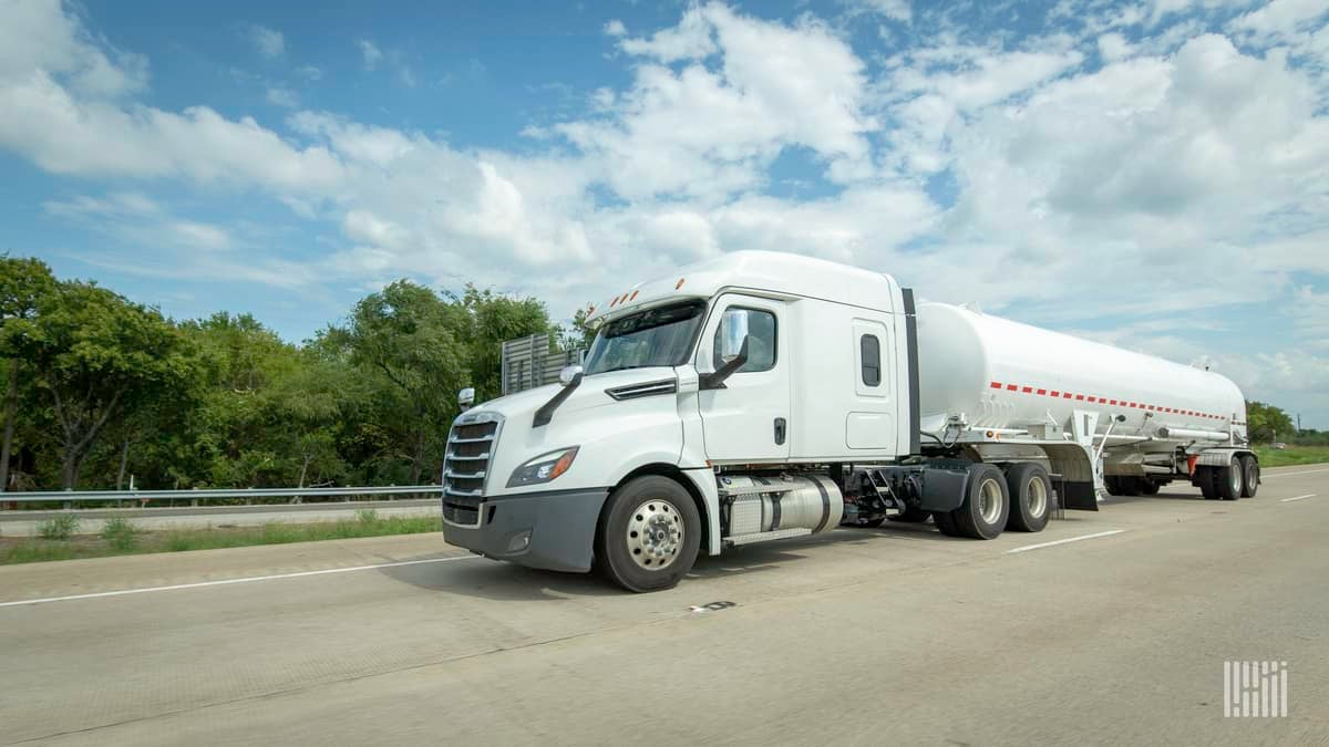 A white semi truck hauling a tanker trailer. Parkland Corp, major Canadian fuel distributor, was targeted in a cyberattack.