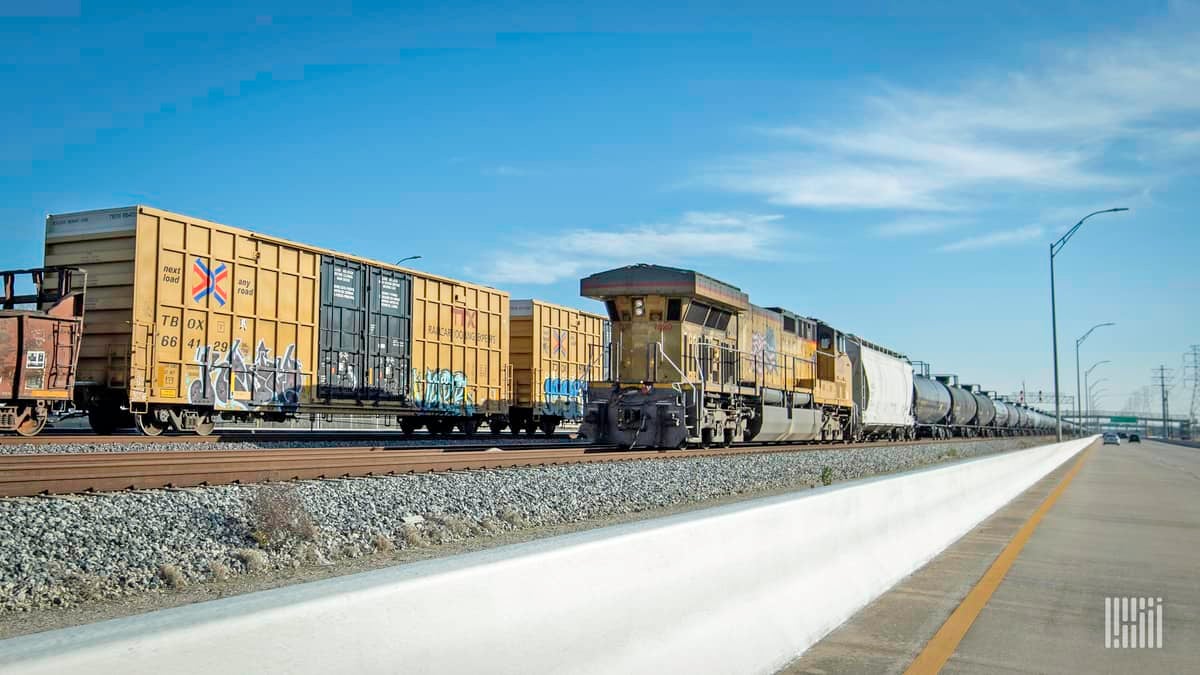 A photograph of a train in a rail yard.