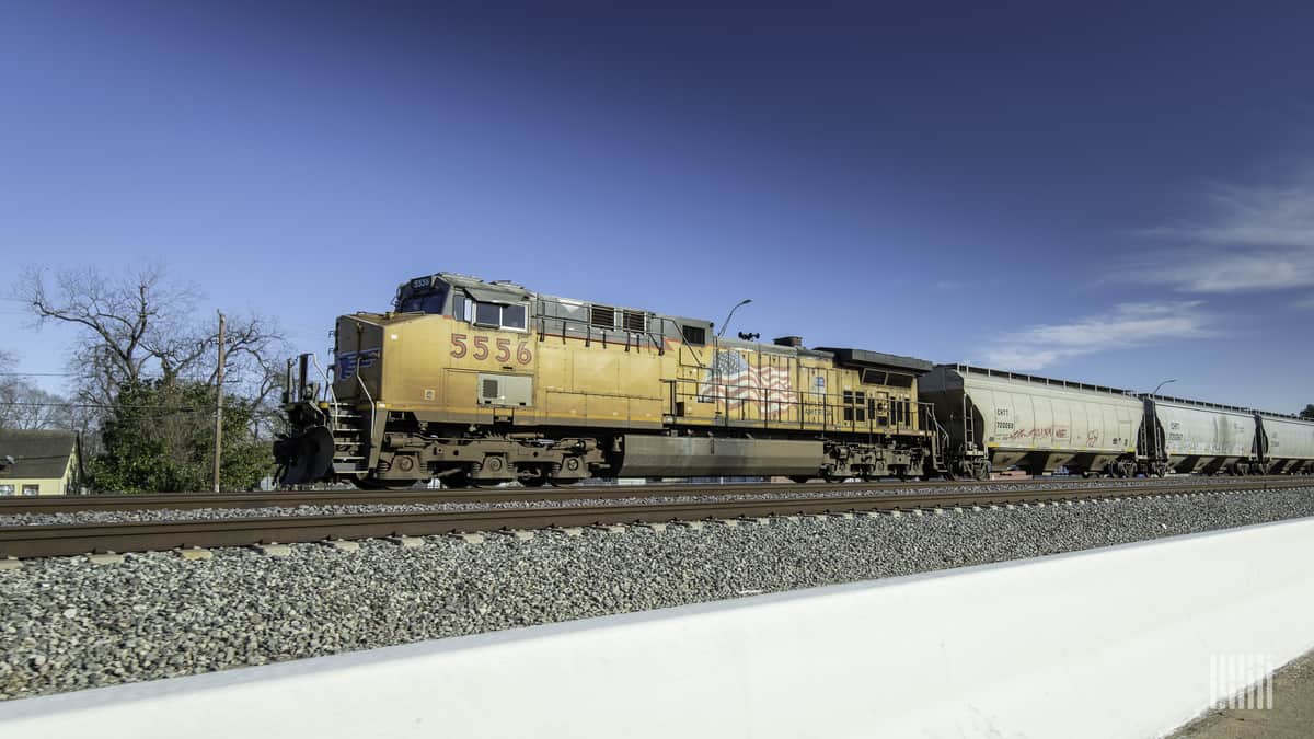 A photograph of a Union Pacific train traveling through a field.