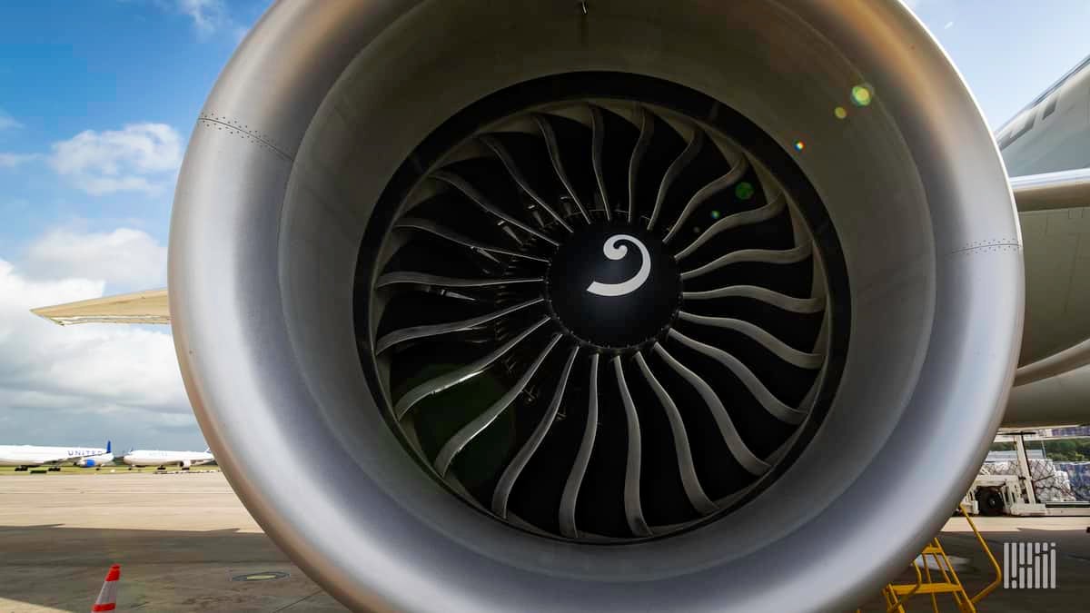 Close up of an aircraft engine staring into the front end.