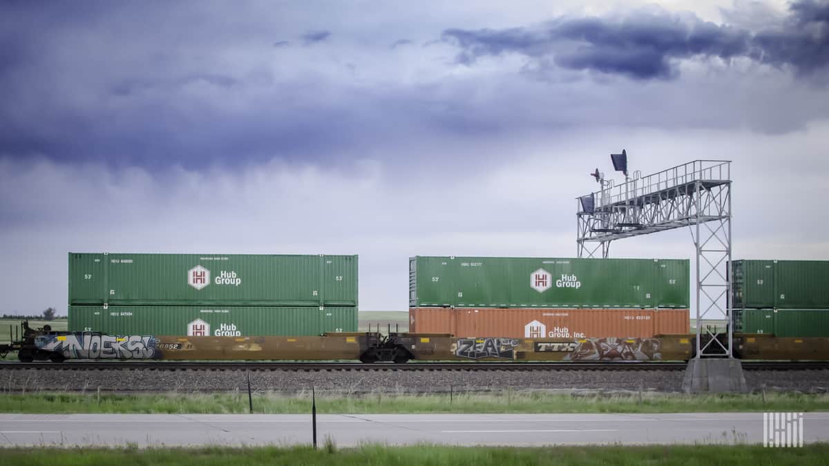 A photograph of intermodal containers belonging to the Hub Group.