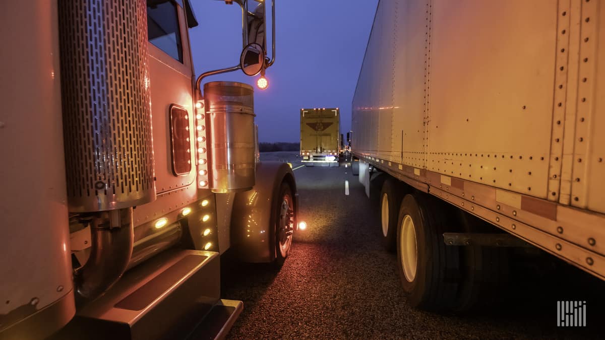 Tractor-trailers stuck in a traffic jam.