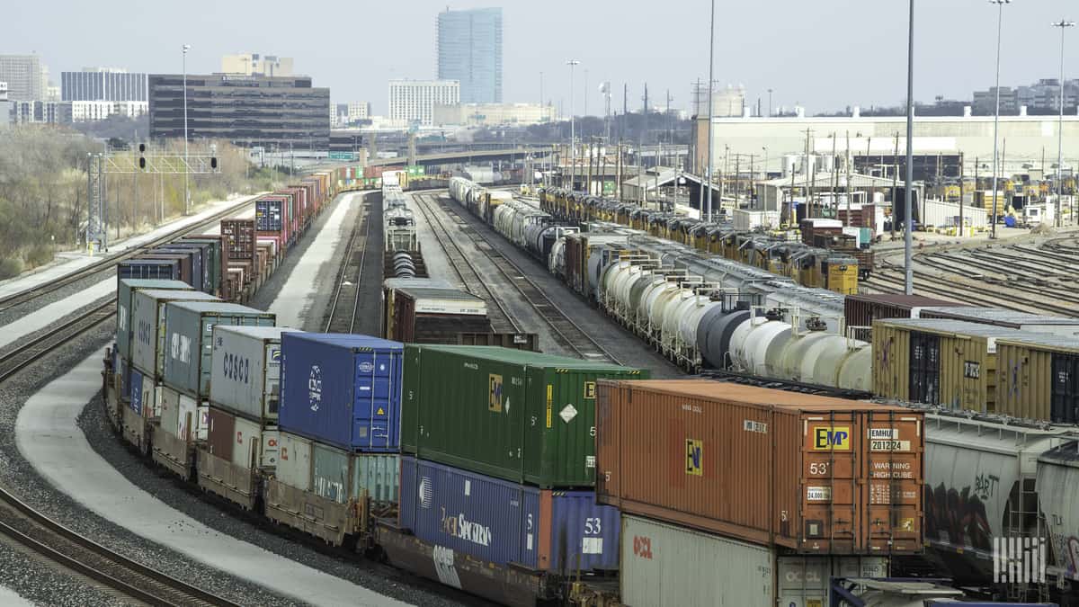 A photograph of intermodal containers parked at a rail yard.