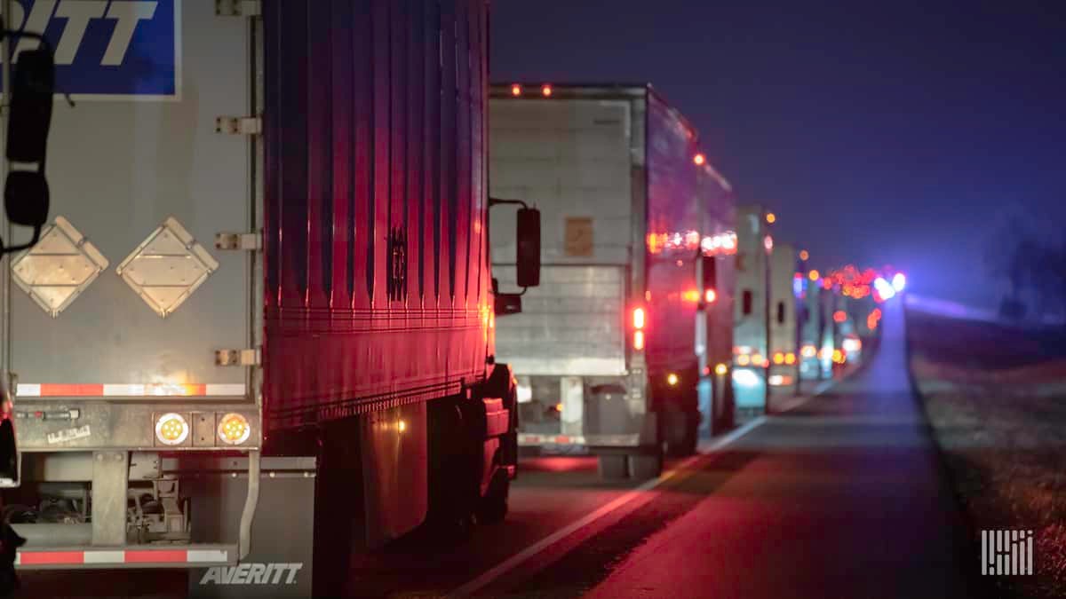 Tractor-trailers stuck in traffic on I-45 near Teague, Texas as road becomes icy on Feb. 13, 2021.