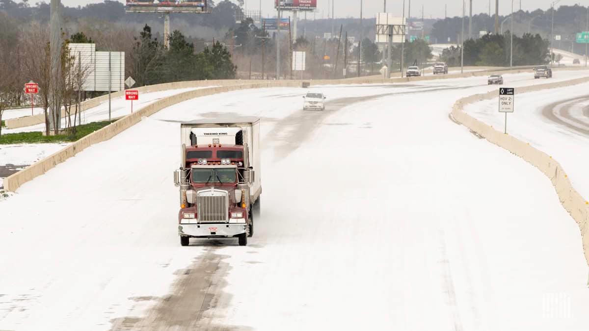 Tractor-trailer on snowy Houston, Texas road on Feb. 15, 2021.