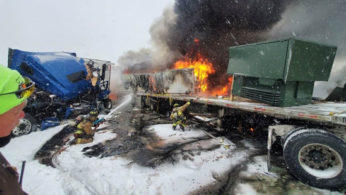 A tractor-trailer burns in Oklahoma in the aftermath of a truck crash during a storm.