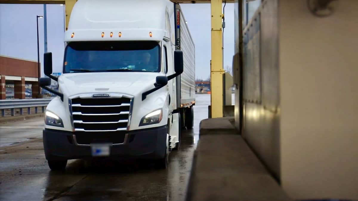 A tractor-trailer awaits inspection at the Fort Street Cargo Facility at the U.S.-Canada border in Detroit. A rookie trucker was arrested there after the discovery of marijuana in a trailer full of pork.