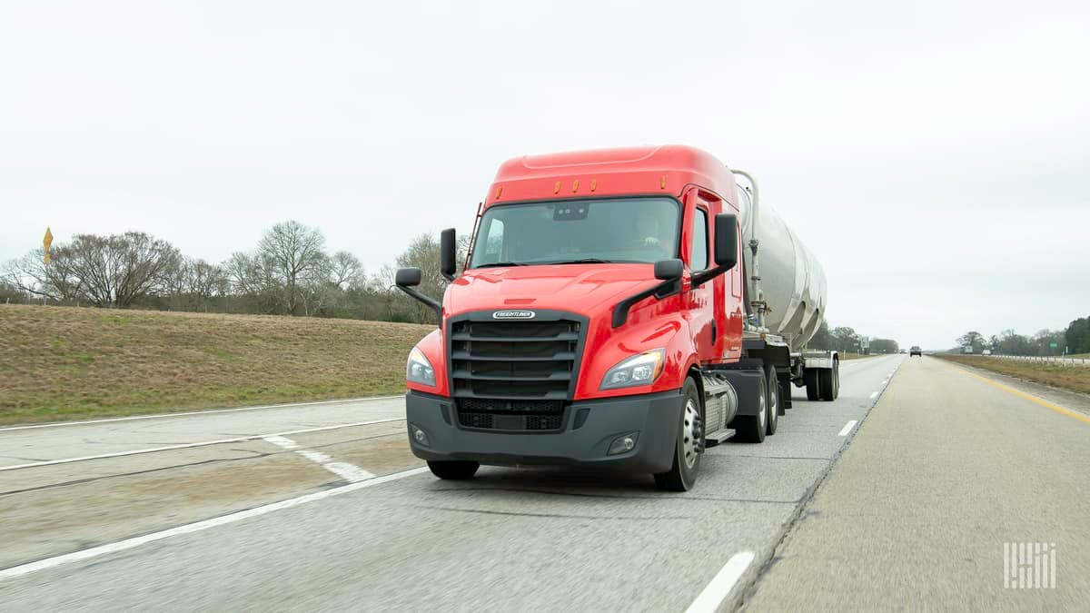 Tanker truck heading down a highway.