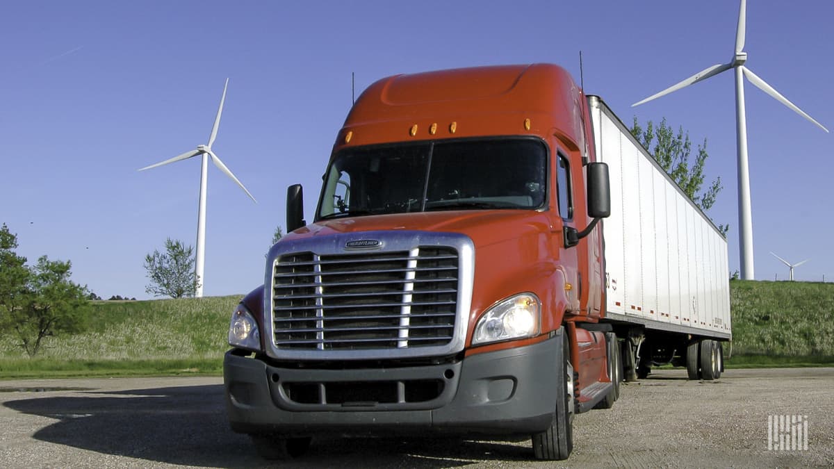 truck in front of windmills