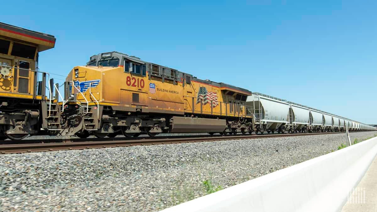 A Union Pacific train hauling rail cars.