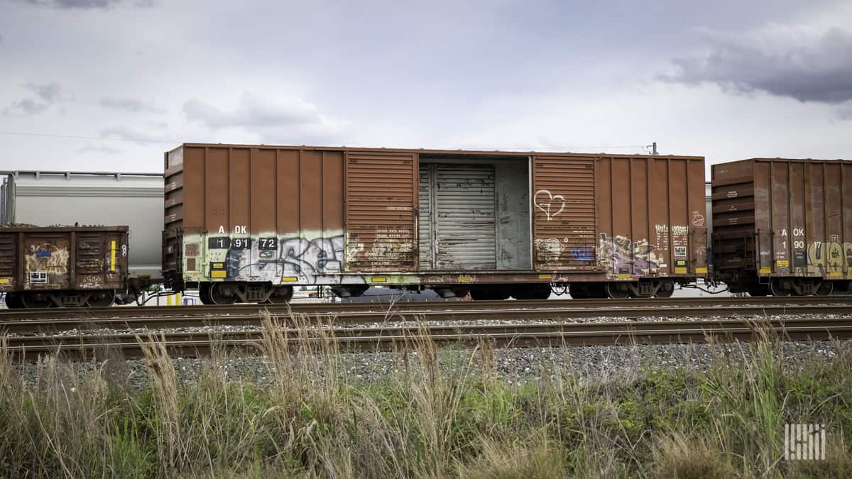 A photograph of an open box car.