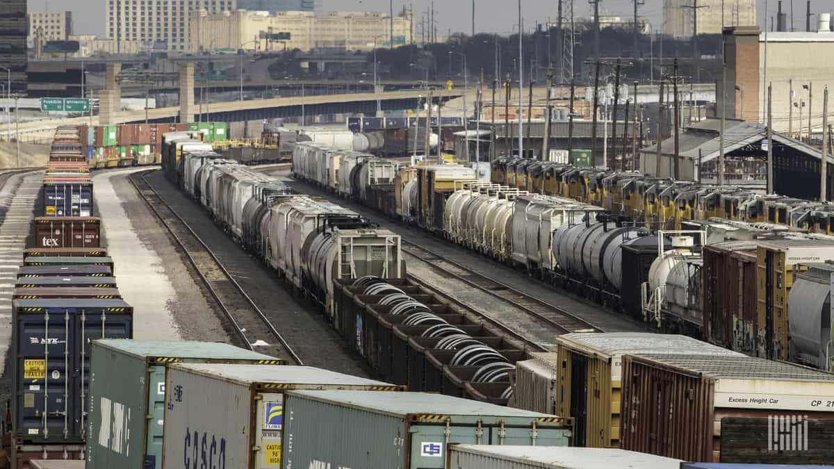 A photograph of railcars parked in a rail yard.