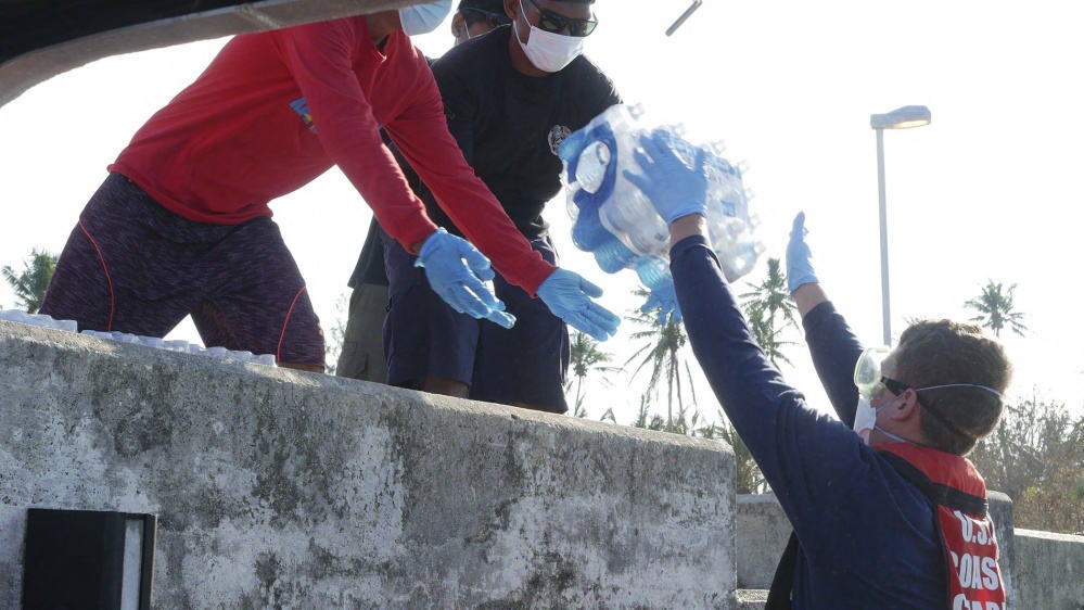 Coast Guard Cutter Myrtle Hazard crew delivers emergency supplies April 24, 2021, to the island of Kayangel, Palau, following Typhoon Surigae.