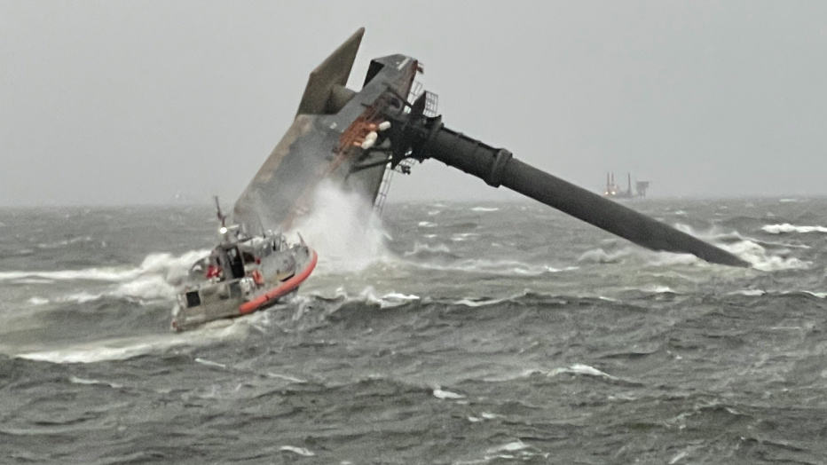 Coast Guard crew searching for missing crew members of the capsized SEACOR Power lift boat.