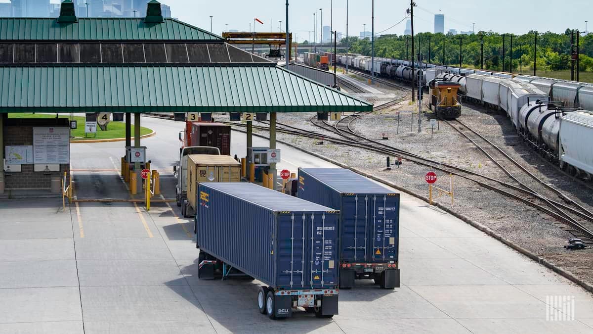 Trucking hauling intermodal containers to illustrate cybersecurity threats to the supply chain.