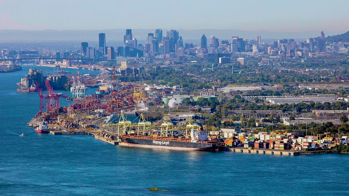 A few of the Port of Montreal and the city skyline behind it.