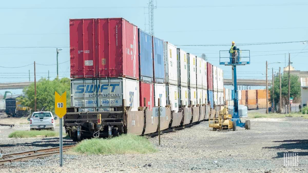 A photograph of a train hauling intermodal containers.