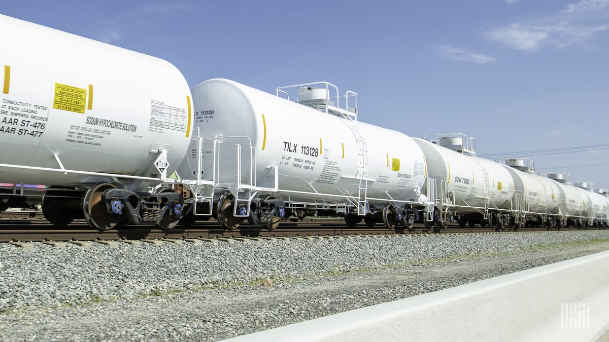 A photograph of tank cars rolling down a railroad track.