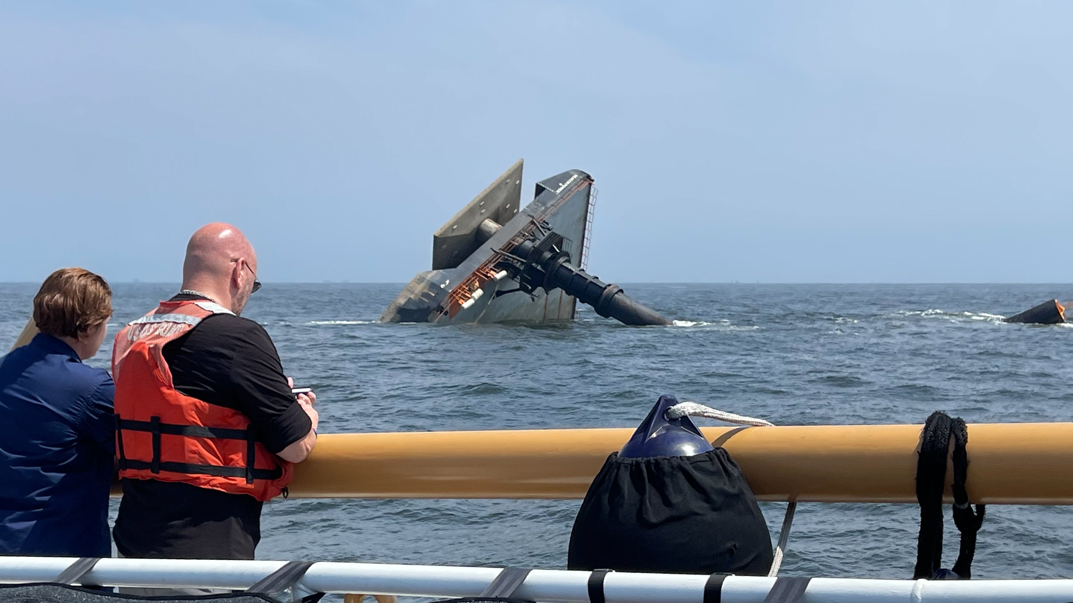 Coast Guard Unified Command team members looking at capsized SEACOR Power in Gulf of Mexico.