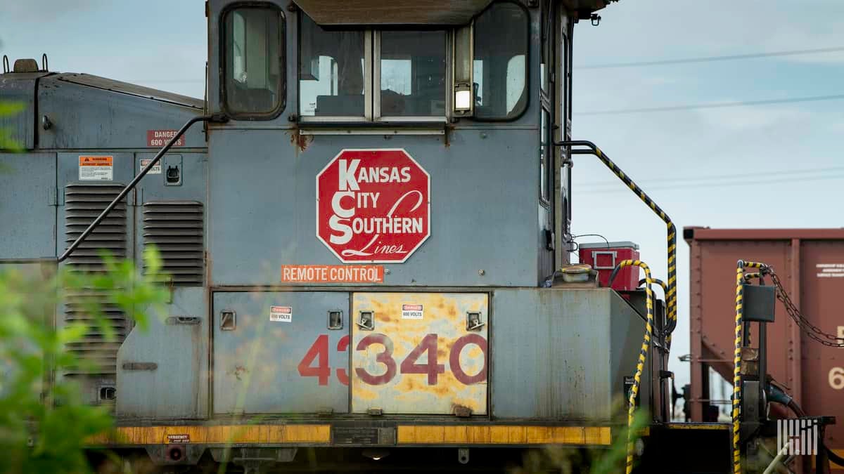 A photograph of rail equipment that has a Kansas City Southern logo on it.