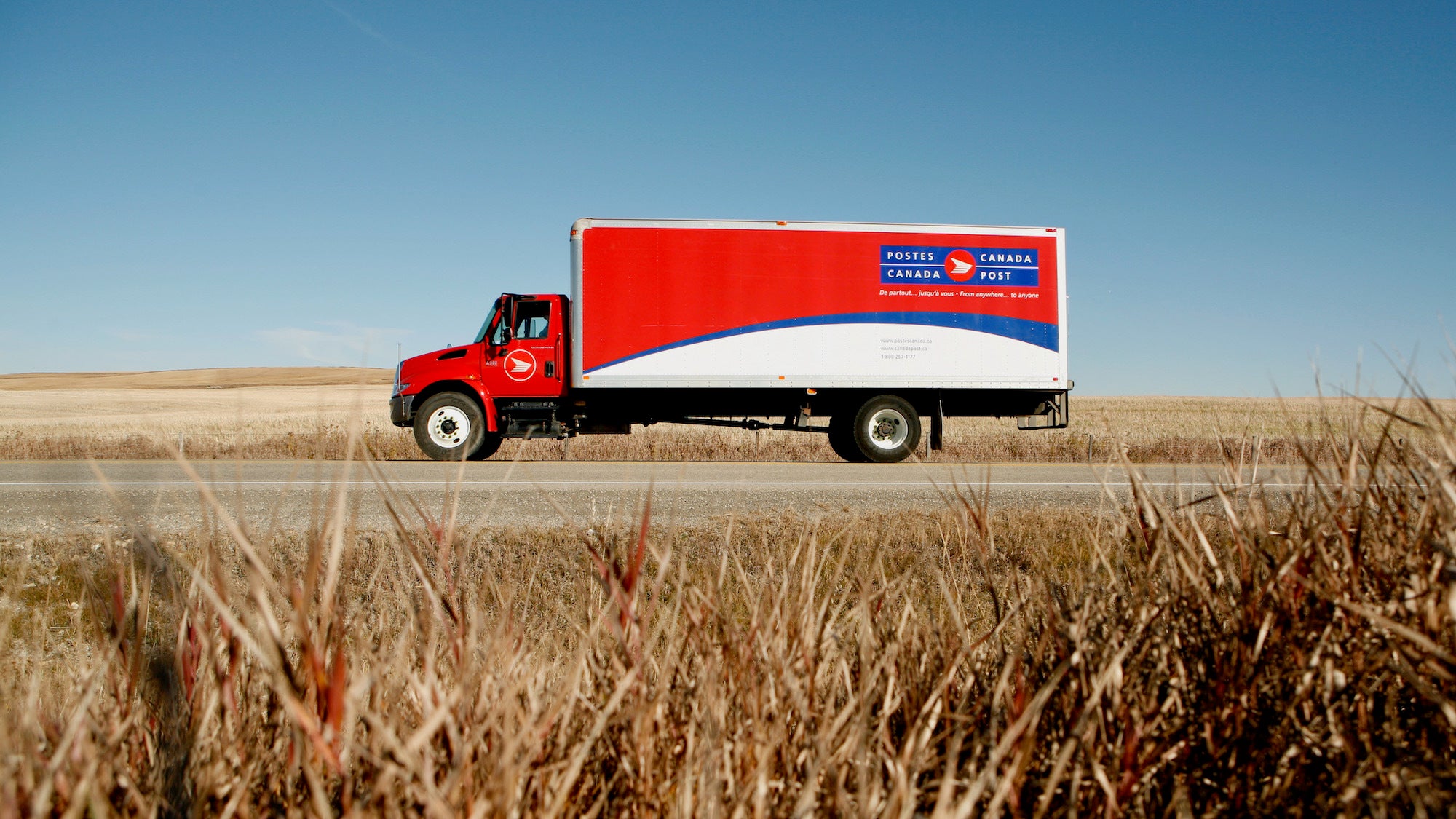 A Canada Post truck viewed from the size.