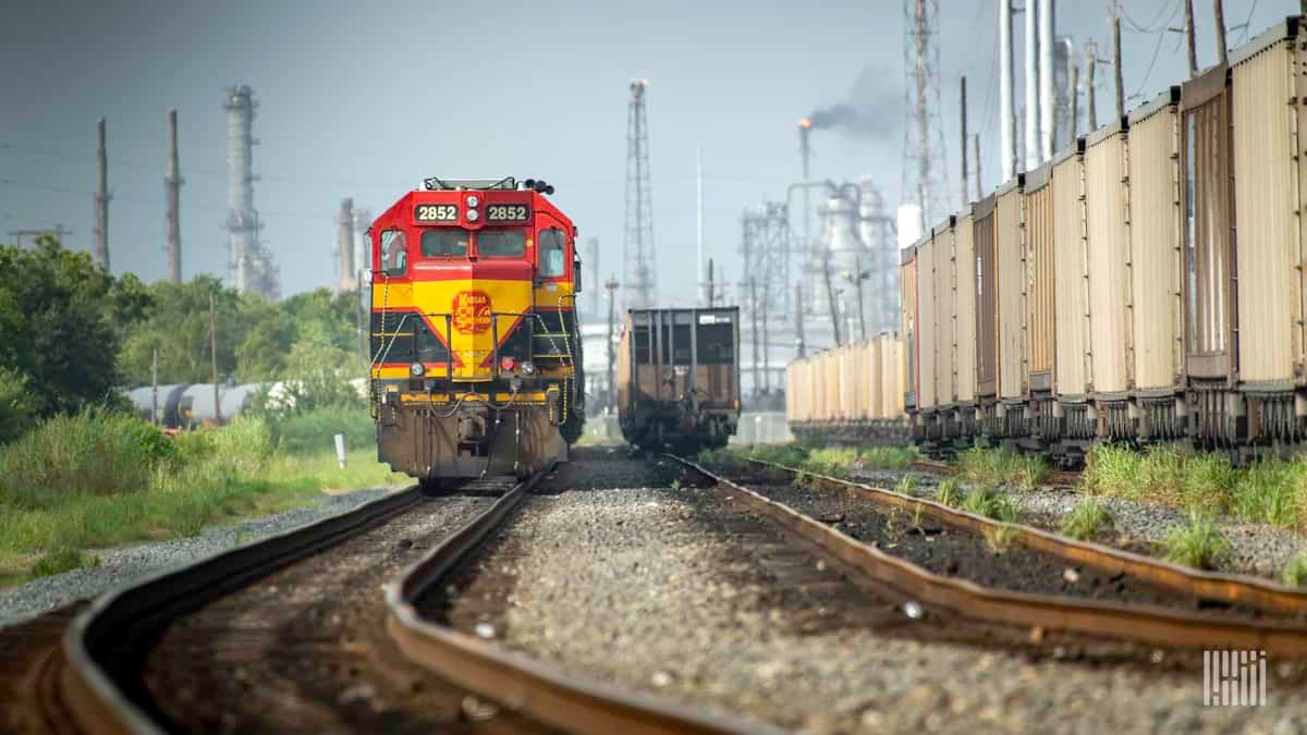 A photograph of a Kansas City Southern train in a rail yard.