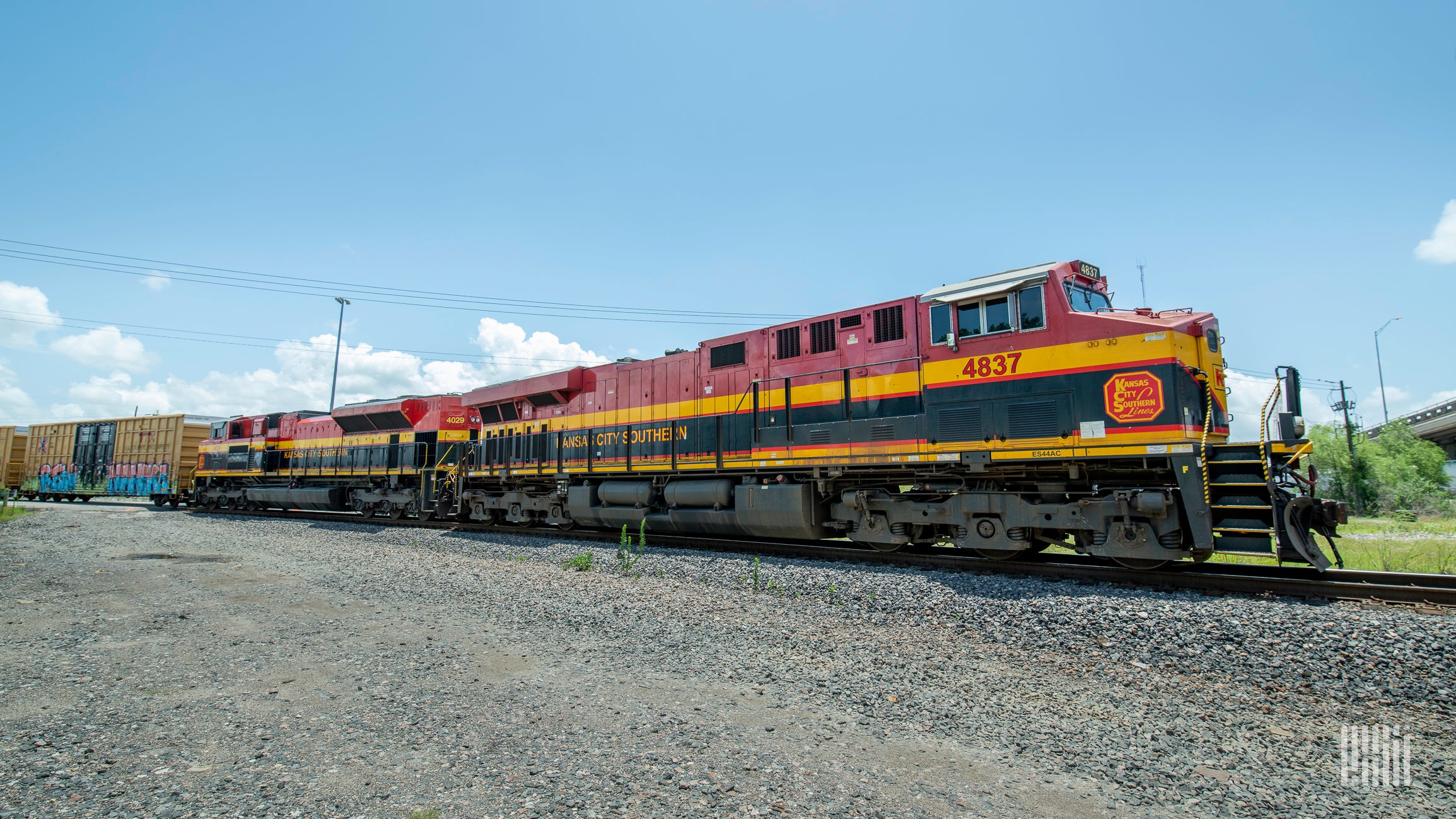 A photograph of a Kansas City Southern train hauling intermodal containers.