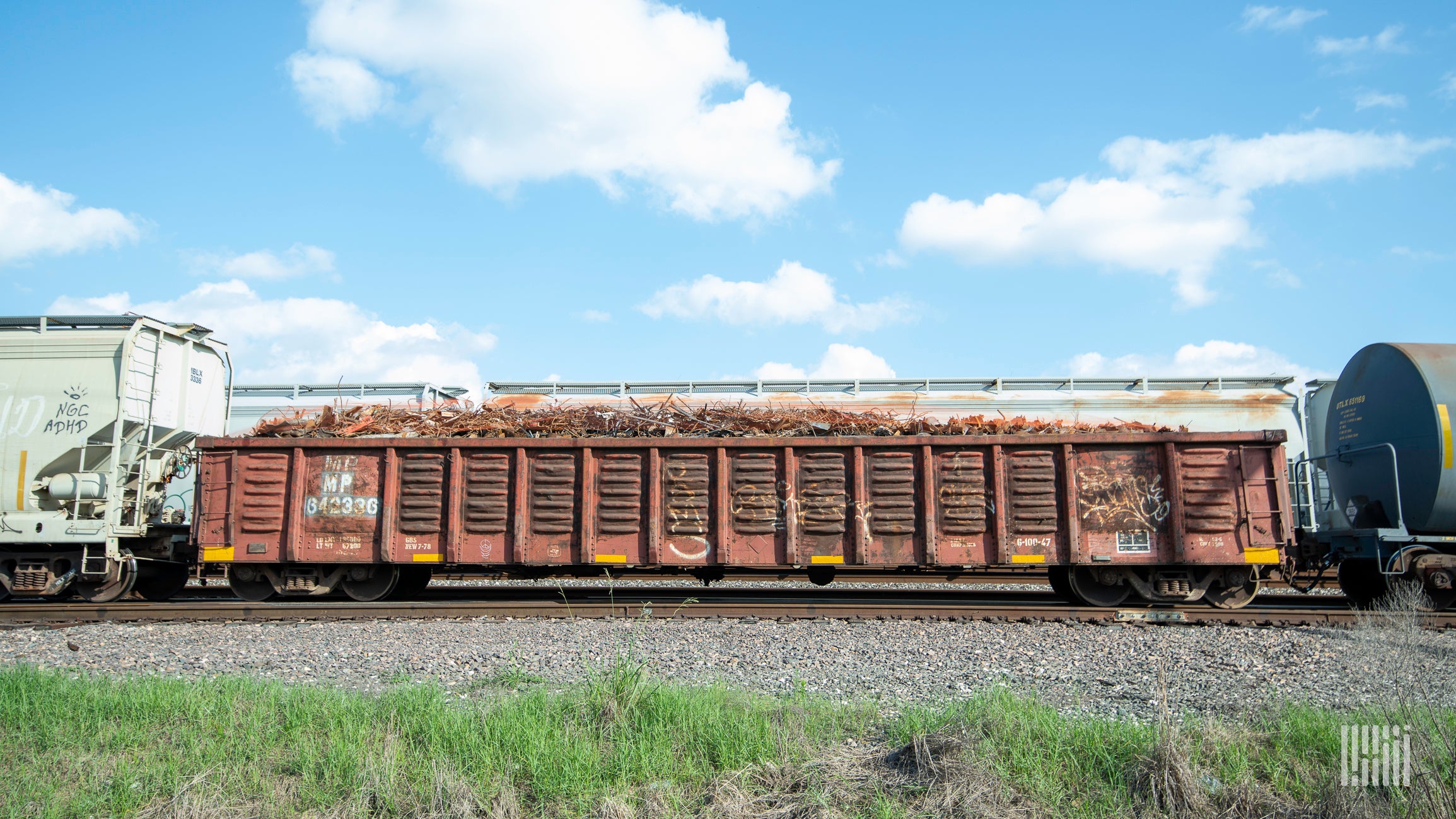 A photograph of railcars on train track.