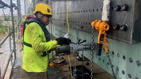 Contractor repairing the I-40 bridge over the Mississippi River.