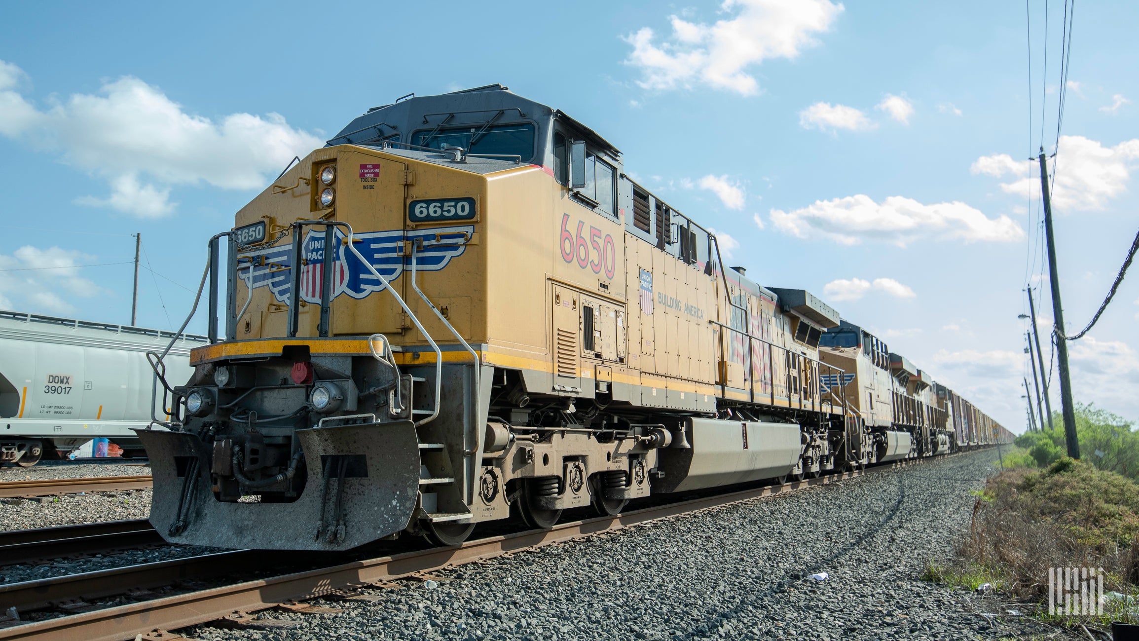 A photograph of a Union Pacific train rolling down a field.