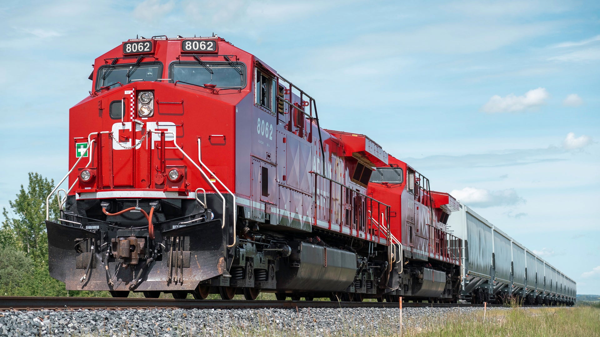 A photograph of a Canadian Pacific train on a train track.