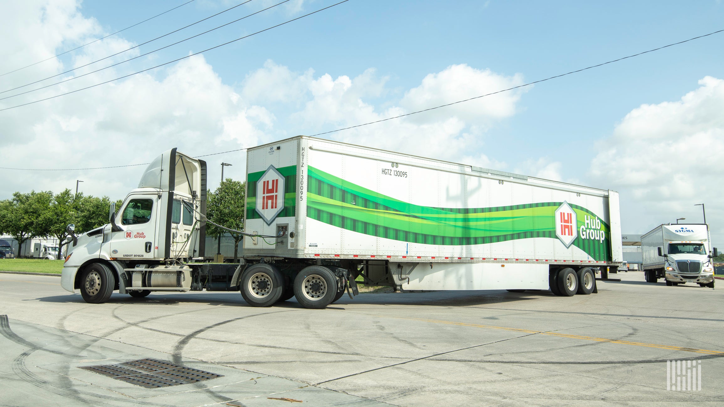 A photograph of a truck that has the Hub Group logo on it.